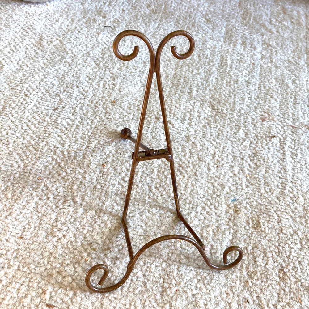 Bronze brown metal easel for plate or picture frame.